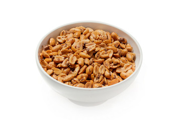 Roasted peanuts in a plate on a white background