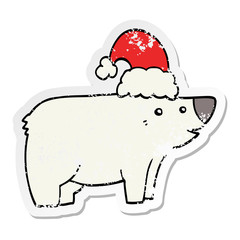 distressed sticker of a cartoon bear wearing christmas hat