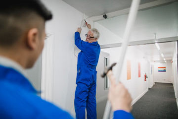Senior Electrician Training his Apprentice