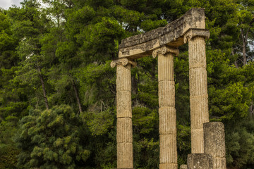 ancient Greece colonnade ruins antique architecture open air museum on green park outdoor trees background, tourism and sightseeing concept photography