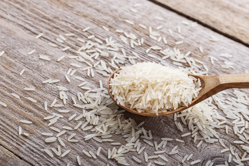 Rice in a wooden spoon.