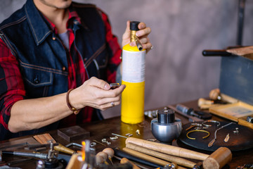 Craft jewelery melting metal. master is working with gas cilinder at jewelry shop