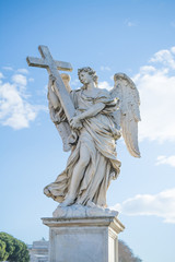 Fototapeta na wymiar Angel holding the Holy Cross, Famous Italy landmarks in Rome
