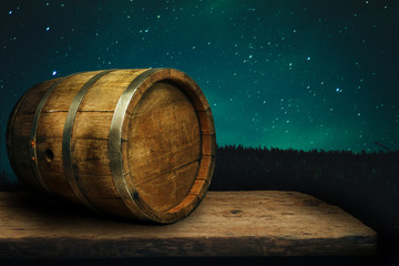 Wooden barrel and worn old table of wood.