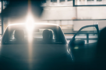 Burglar robbing a car