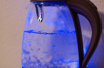 A shining kettle with boiling water
