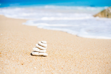 Fototapeta na wymiar Stack of round smooth stones on a seashore