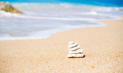 Stack of round smooth stones on a seashore