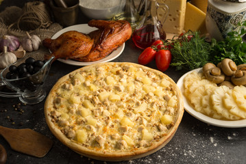 Whole fresh pizza with chicken and pineapple