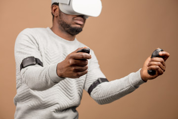 Man in VR glasses now is playing 3D game but Mankind stands on the threshold of a new era of...