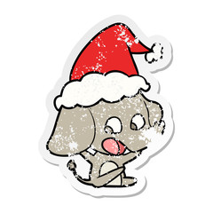 cute distressed sticker cartoon of a elephant wearing santa hat