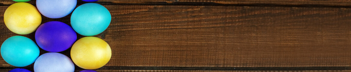 Many eggs on wooden background. Concept and happy Easter holiday