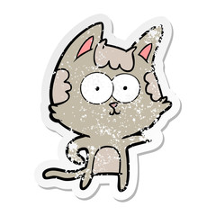distressed sticker of a happy cartoon cat pointing