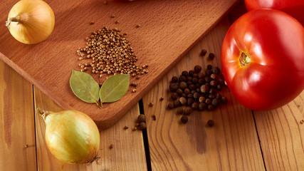Preparation of culinary dishes using tomatoes, onions and various spices.