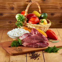 Meat dish for men, stuffed with pepper, rice with meat and spices, vegetables on the table, tasty food - energy throughout the day.