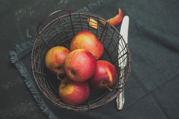 Red apples on dark background, top view