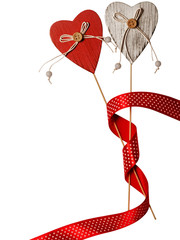 Heart sticks Decorations with red dotted ribbon isolated. Vertical view. Concept of wedding and Valentines day.