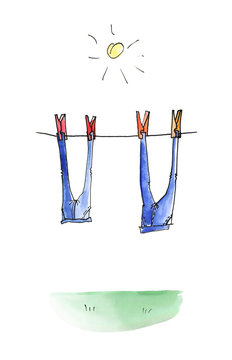Two pairs of jeans are dried on a rope in the sun
