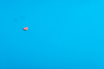 Face with sugar heart mouth on blue background