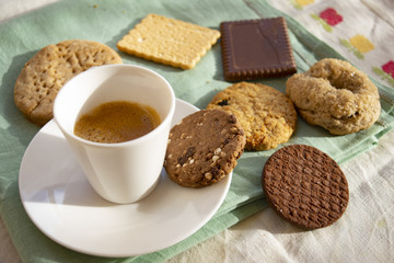 espresso cup with assorted cookies