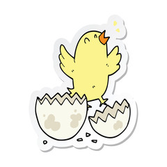 sticker of a cartoon bird hatching from egg