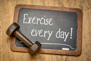 exercise every day - text on blackboard
