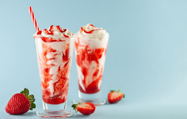 Strawberry milkshake with whipped cream.