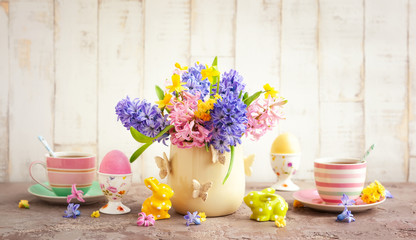 Easter breakfast table with flowers and  Easter decor
