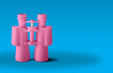 Pink binoculars isolated on blue background	