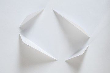 folded sheet of paper on white background