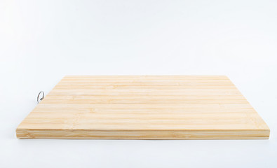a bamboo chopping board on a white background