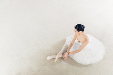 top view photo. talented ballerina has finished her wonderful performance, copy space. relaxation