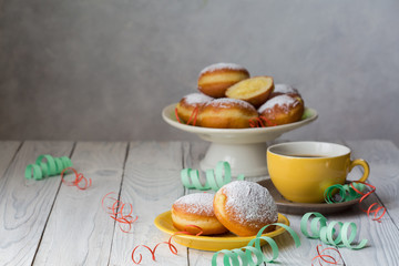 Bombolone - filled sweet yeast dough fried in oil, with a cream. Italian carnival  doughnuts.