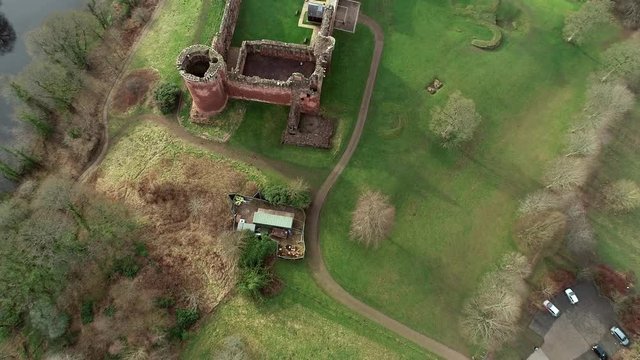 Aerial footage of Bothwell Castle near Uddingston in Scotland. Dramatic location by a winding curve in the River Clyde.