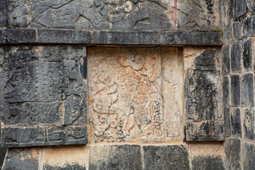 Detail of bas-relief carved panel of a Jaguar holding a heart in its paw on the Great Platform of Eagles and Jaguars found on the grounds of  the  Maya Ruins of Chichen Itza