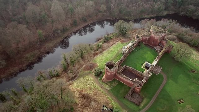 Aerial footage of Bothwell Castle near Uddingston in Scotland. Dramatic location by a winding curve in the River Clyde.