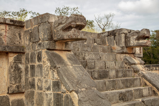 Detail of one staircase leading up to the Great Platform of Eagles and Jaguars depicting Quetzalcoatl serpent found on the grounds of  the  Maya Ruins of Chichen Itza
