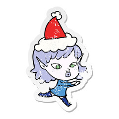 pretty distressed sticker cartoon of a elf girl wearing santa hat