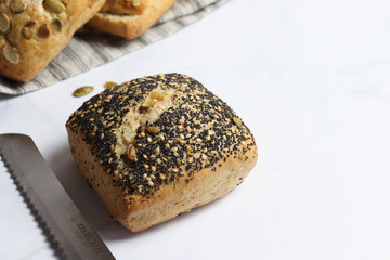 Freshly baked square shaped buns with seeds
