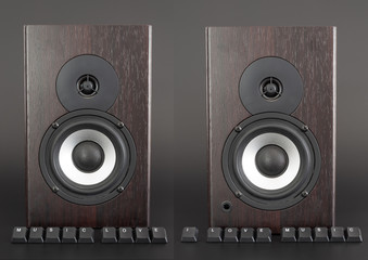 Keyboard buttons labeled music love in front of the wooden speaker
