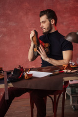 hardworking man enjoys his work in the workshop, close up photo.occupation,