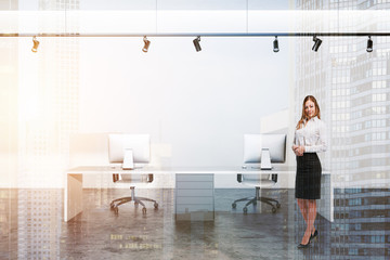 Woman in white modern office workplace interior