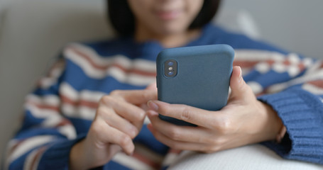 Woman use of mobile phone at home