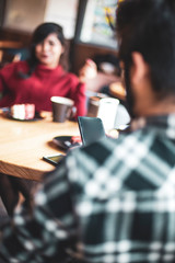 04.02.2019 Vinnitsa, Ukraine: people spend happy time in the cafe. selective focus, noise effect