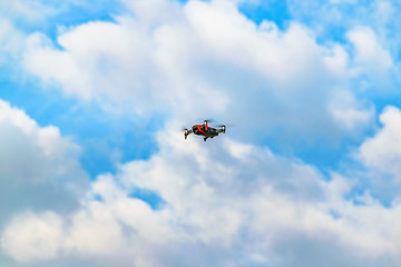 Fototapeta na wymiar Drone at Cumulus Sky Background