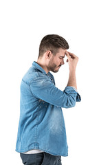Young man in jeans shirt thinking hard, isolated