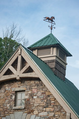 Horse weather vane on upscale barn cuppola
