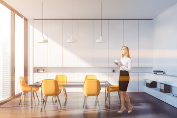 Woman in panoramic white meeting room interior