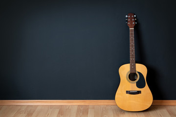 Acoustic guitar  in empty room