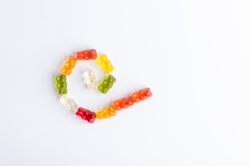 spiral jelly bears, different colors on white background